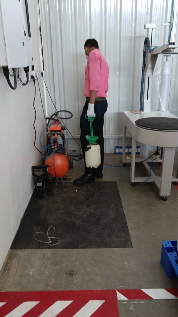 Star Link Pest Control technician preparing treatment equipment at a commercial facility