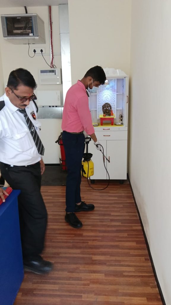 Star Link Pest Control technician treating an indoor commercial area